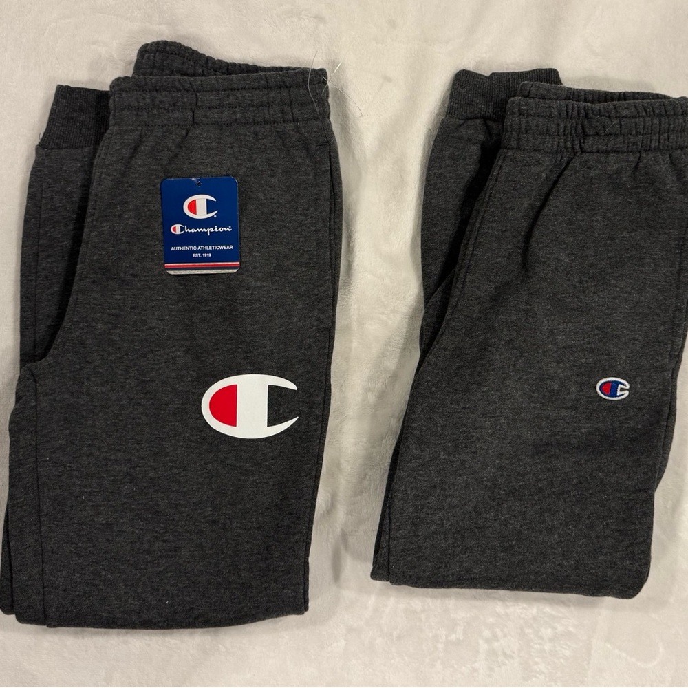 2 pairs of Champion Youth Medium Gray Sweatpants.  1 new, one used.